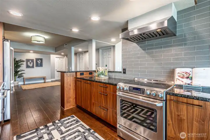 Well designed with work areas on both sides of the range.  Nice custom detail on the range hood.