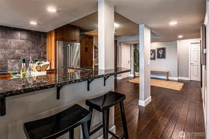 Wraparound eating bar for casual dining or buffet serving on game day.