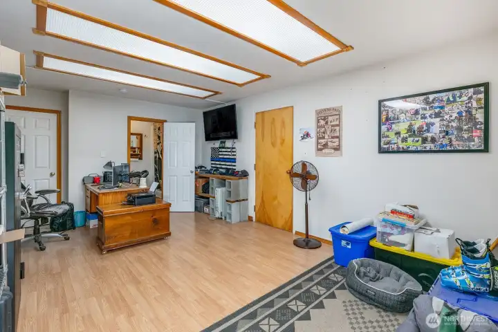 This office is attached to the garage and has a full bathroom too!