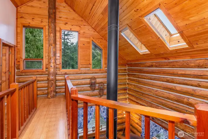 Upstairs is open and offers great views of the living room