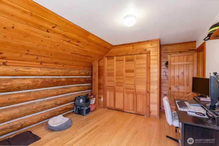 second bedroom upstairs in the log home