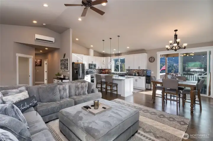 Spacious open living, dining, and kitchen with lake views