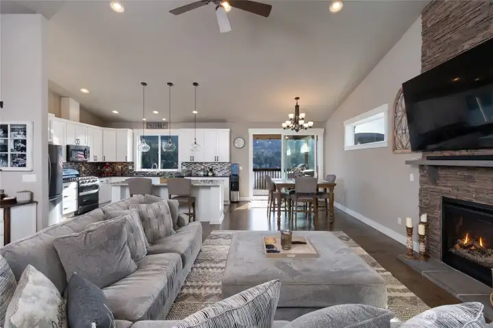 Open-concept living room with fireplace and modern finishes