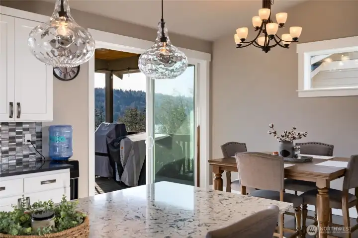 Bright dining area with patio access and scenic outdoor views