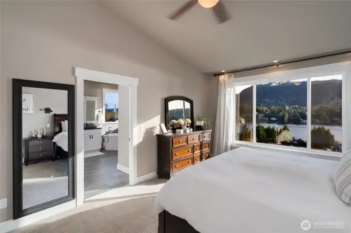 Primary bedroom with lake views and en suite access
