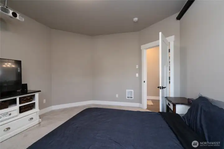Comfortable bedroom with soft carpet and neutral tones