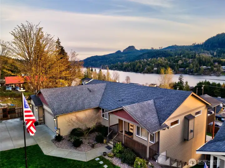 Aerial view of home with lake, mountain, and neighborhood views