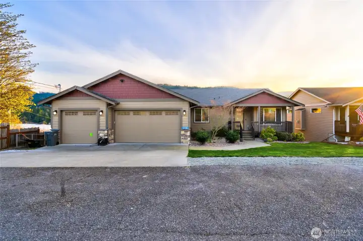 Craftsman-style home with three-car garage and curb appeal