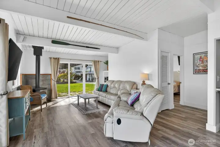 Propane free standing stove in the living room. Propane tanks are owned so you can choose who you want to supply you with,