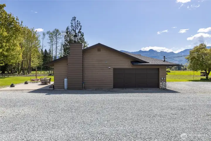 Side of home with double car garage.