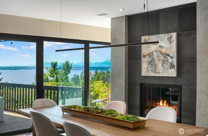 Spacious dining area anchored by designer lighting and direct access to the view deck