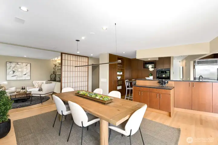 Spacious dining area anchored by designer lighting and direct access to the view deck