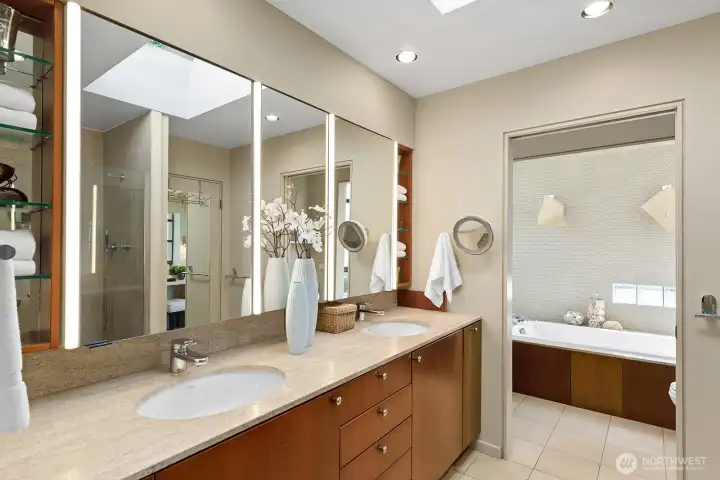 Spacious primary bath with dual vanities, ample storage, and clean contemporary design