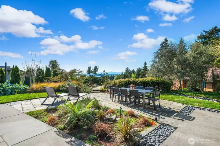 Elevated garden viewpoint with stunning water vistas and natural stone accents