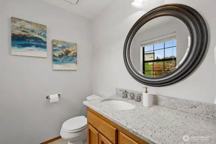 Half bath is across from the laundry room with shower.