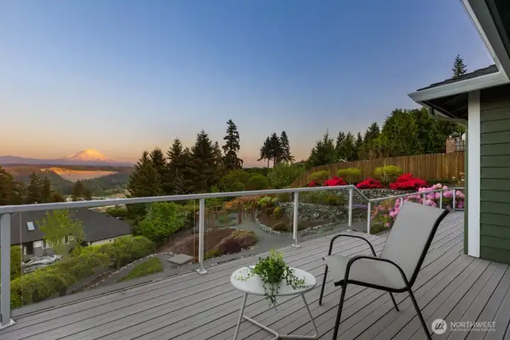 A wraparound composite deck offers expansive outdoor living with easy, low-maintenance care.