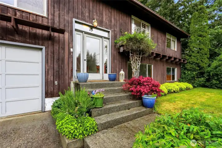 Concrete steps and a glass-panel entry keep things bright, clean, and built to last. Concrete steps and a glass-panel entry keep things bright, clean, and built to last.