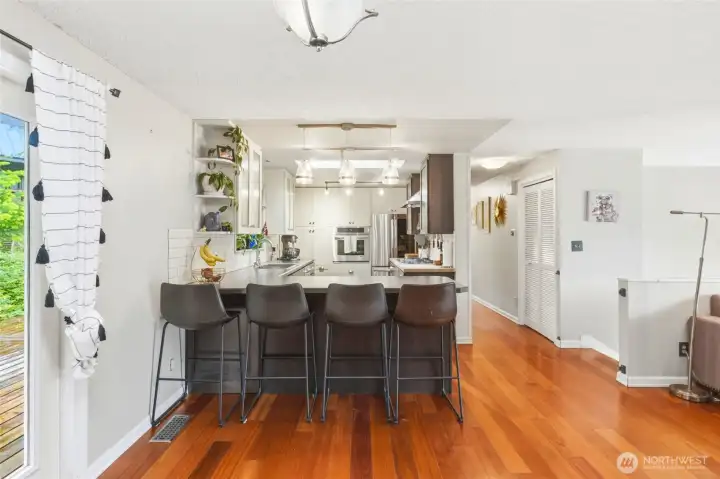 Kitchen peninsula with bar seating for casual dining. Kitchen peninsula with bar seating for casual dining.