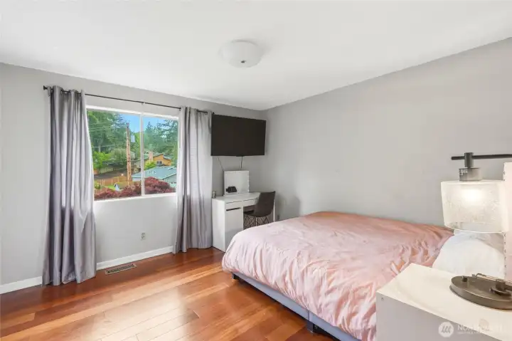 A well-proportioned second bedroom with hardwood floors and south facing sun — comfortable for guests, kids, or a dedicated home office. A well-proportioned second bedroom with hardwood floors and south facing sun — comfortable for guests, kids, or a dedicated home office.