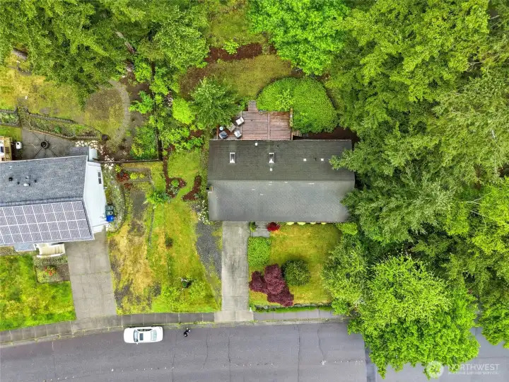 An aerial view reveals what street-level can't — a deep, private lot with a surprising amount of green space for an in-town location. An aerial view reveals what street-level can't — a deep, private lot with a surprising amount of green space for an in-town location.