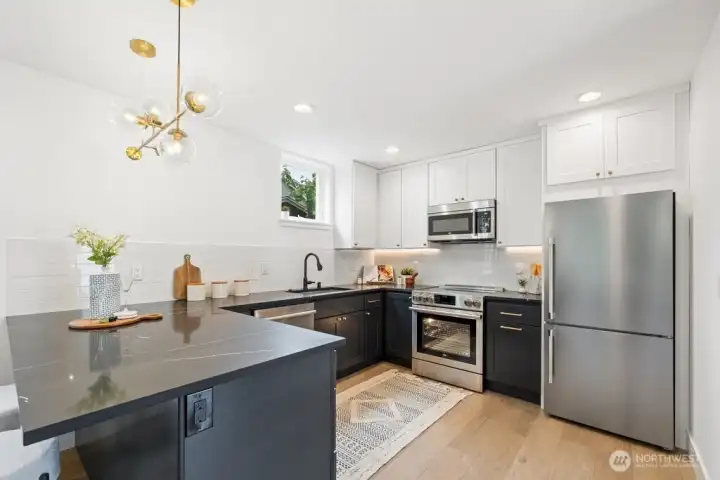 Generous open chef’s kitchen featuring quality Beko stainless appliances Generous open chef’s kitchen featuring quality Beko stainless appliances
