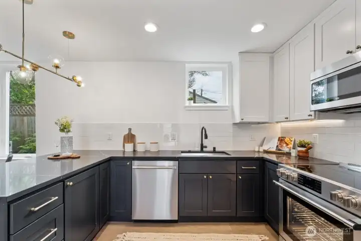 Duotone designer cabinetry with lots of counter space Duotone designer cabinetry with lots of counter space