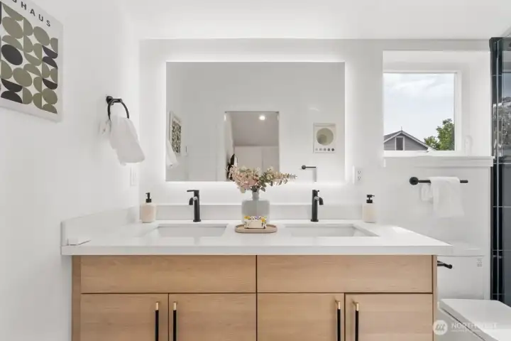 Primary en-suite boasts dual sinks, walk-in shower Primary en-suite boasts dual sinks, walk-in shower