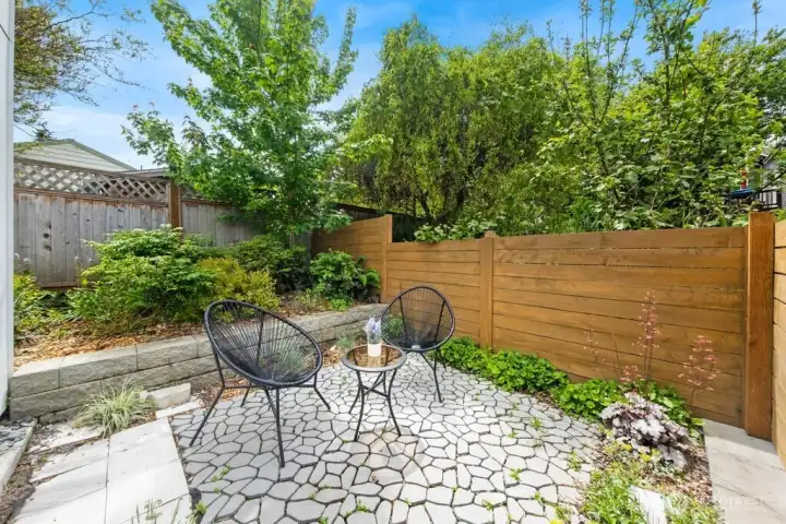Fully fenced private patio and yard with garden area Fully fenced private patio and yard with garden area