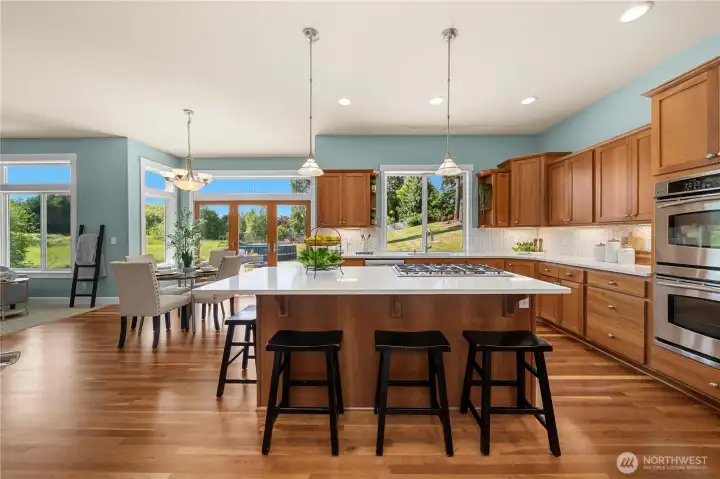 Expansive breakfast-bar island is the heart of the kitchen Expansive breakfast-bar island is the heart of the kitchen