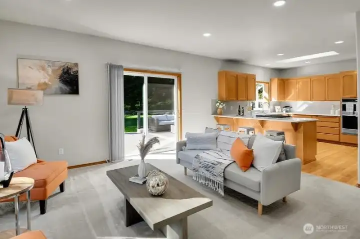 Both the family room and the kitchen flow out to the back deck