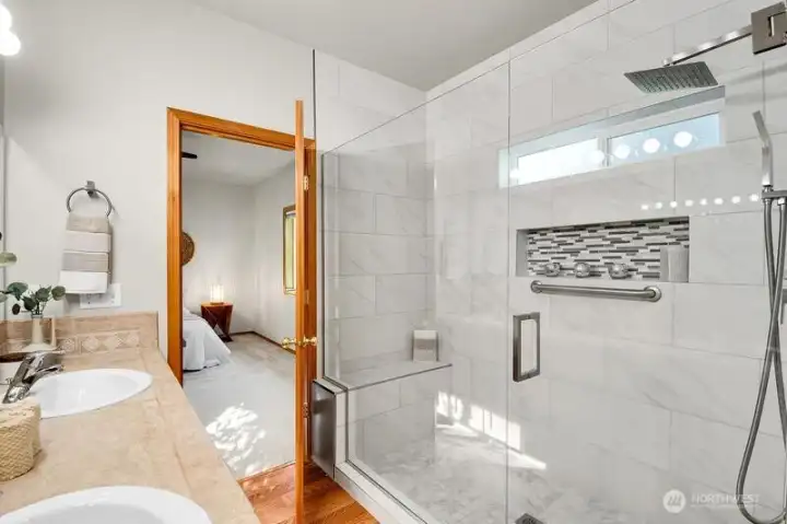 New shower stall with storage alcove and bench seat