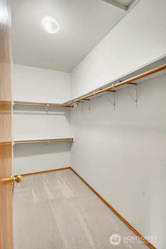 Walk-in closet in primary bedroom