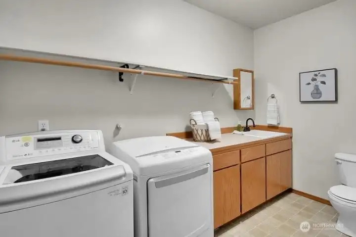 Utility room with half bathroom