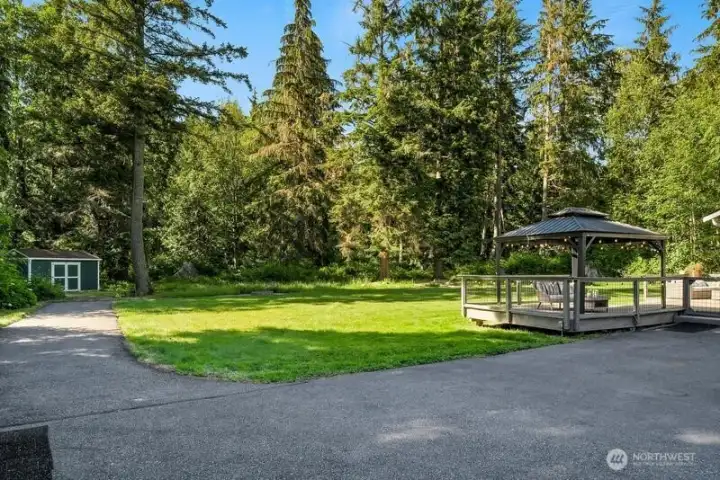 Paved area and path in back yard to additional outbuilding