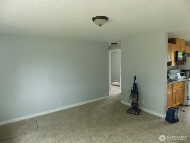 Living room looking towards kitchen and bedrooms.