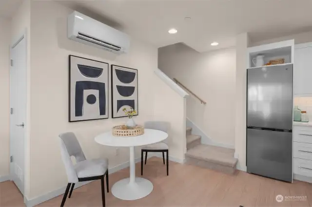 This dining area is an ideal corner for a quiet breakfast or an evening meal, combining minimalist design with cozy comfort. The stairway nearby leads you to more of this beautiful home’s hidden gems.