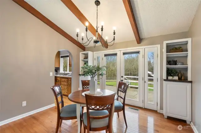 Dining Room with Built in Shelves and Hardwood Floors with French Doors to the Deck & Patio/Firepit!