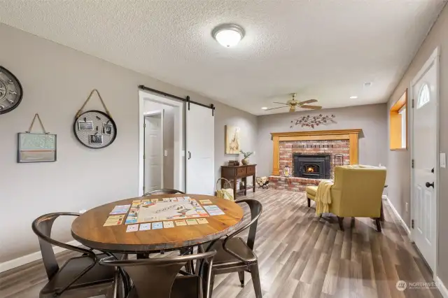 Family Room Ready For Game Night! Cozy Fireplace, Lots Of Natural Light, New Luxury Vinyl Plank Flooring, Exterior Door  to the Backyard!