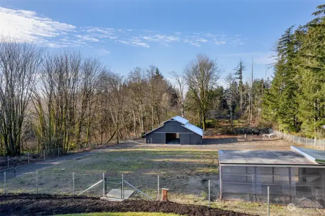 View of the Chicken Coop and Barn.  Fun to watch your farm animals from multiple places in this home.