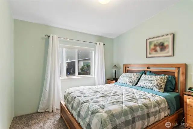 The 2nd bedroom is just a few steps away from the walk-in closet room and newly updated bathroom w/walk-in shower.