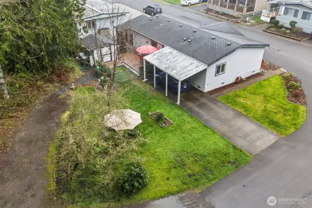 Corner lot location provides extra elbow room, extra parking and outdoor enjoyment.