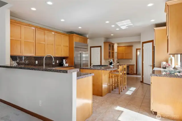 Eat In Kitchen with 2 counters that can utilize bar stools - tall ceilings & canned lighting.