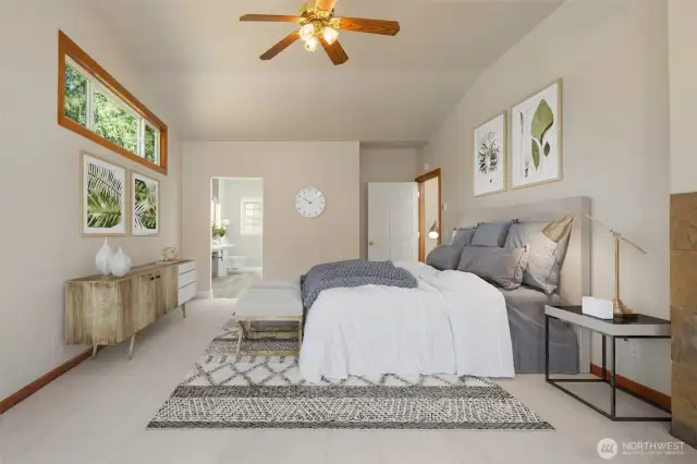 Large Primary Bedroom with level out access to deck & lake. Cozy gas fireplace. Fresh carpets & paint through-out.