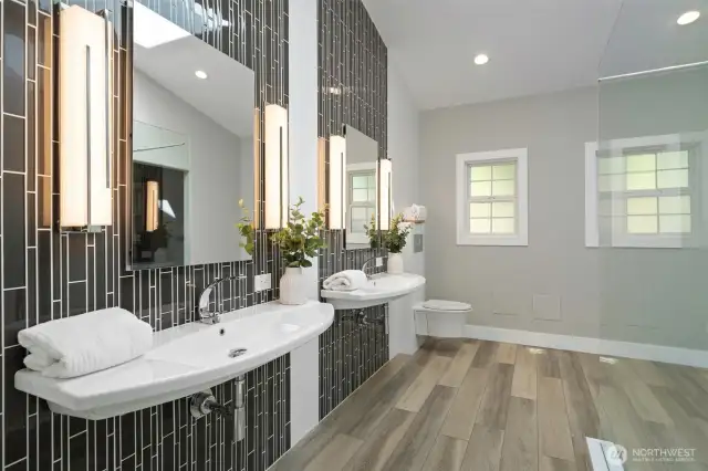 Large stunning newer primary bathroom - all ADA accessible with generous sinks, showers and walk in closet.