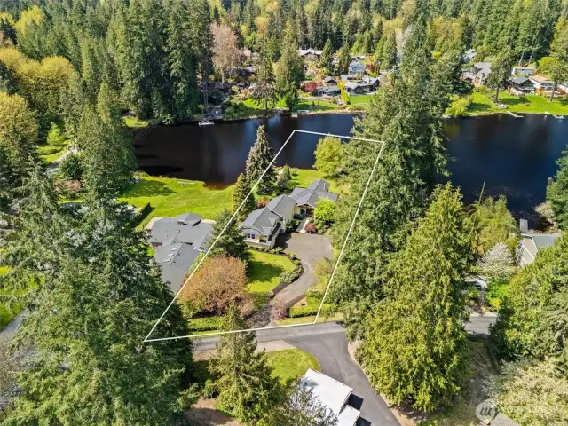 Photographers aerial view showing approximate lot lines. Professional survey done, plans available. Snohomish County shows 33,106 square foot lot - one of the larger waterfront parcels in the community.