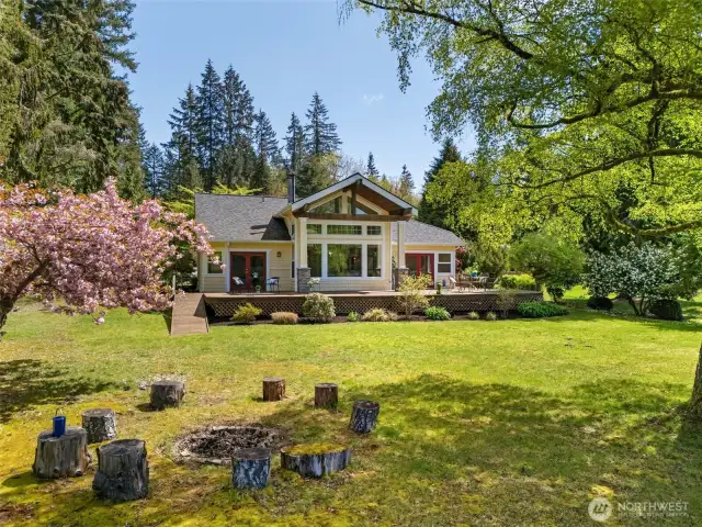 Nice large level to lake yard with firepit, lawn for games, dock and easy lake access to swim or fish!