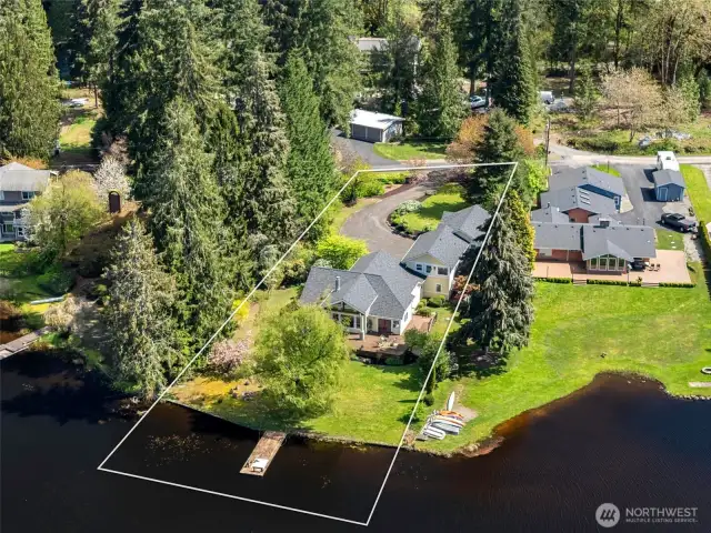 Aerial View of home and property showing photographers outline of estimated boundaries. Professional survey available to view.