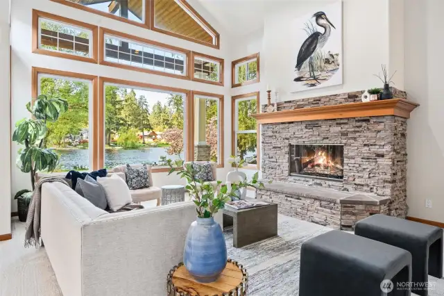 Large Rock Gas Fireplace, High Ceilings & Open Windows to Lake Views. Fresh Paint & Carpets through-out!