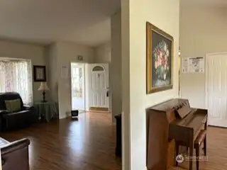 Entry - Great room and piano area adjacent to dining/kitchen