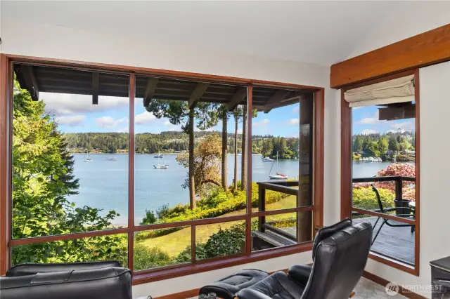 View from the living room with wall to ceiling windows plus vault and a wrap around view.